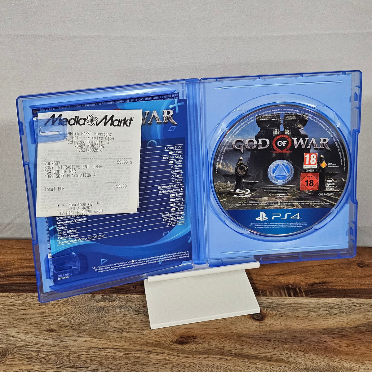 God of War für PlayStation 4 – geöffnete Originalhülle mit Spiel-Disc und Beilagen
