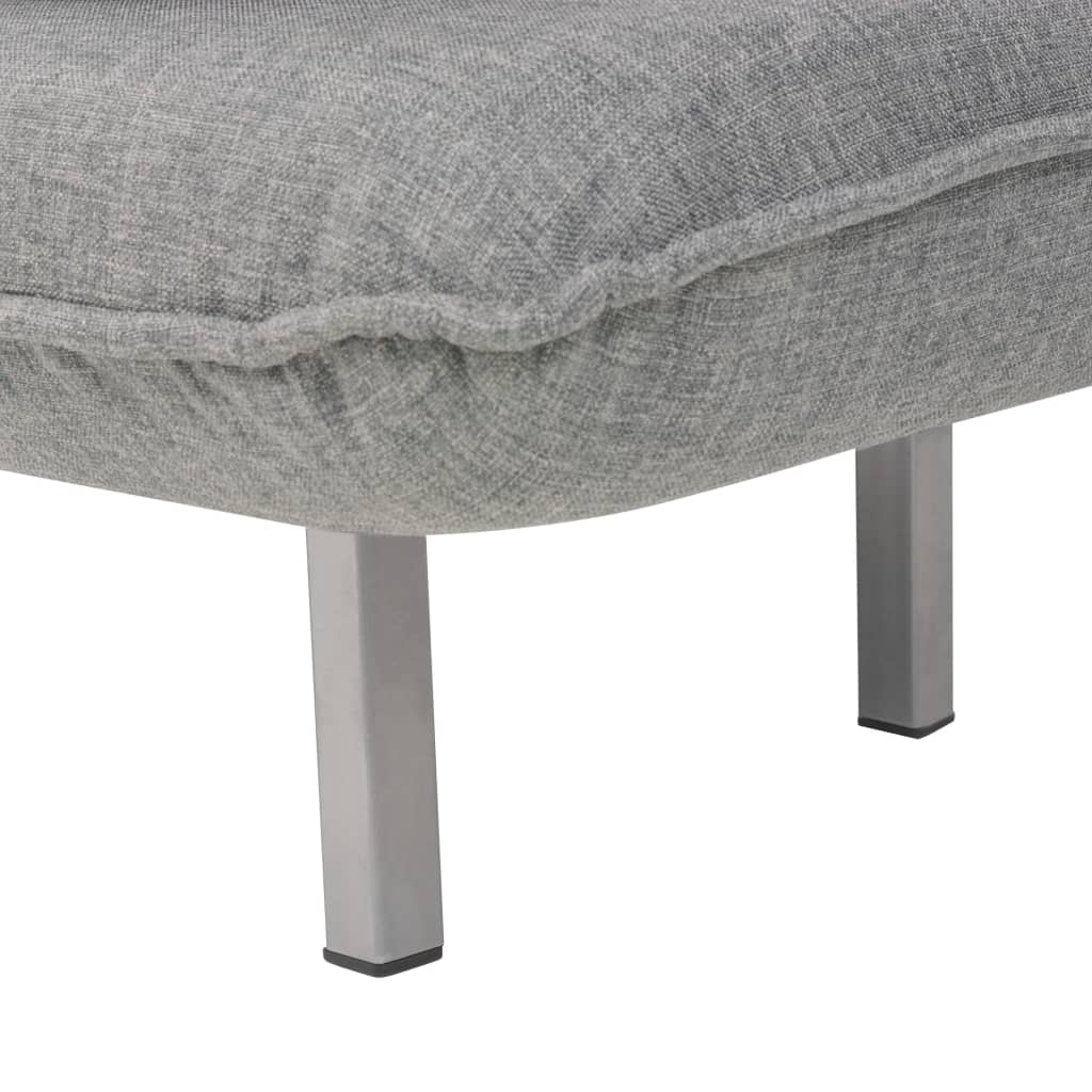 Fauteuil pivotant et canapé-lit en tissu gris clair