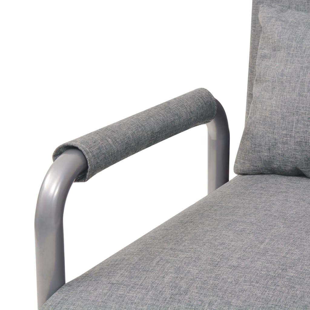 Fauteuil pivotant et canapé-lit en tissu gris clair
