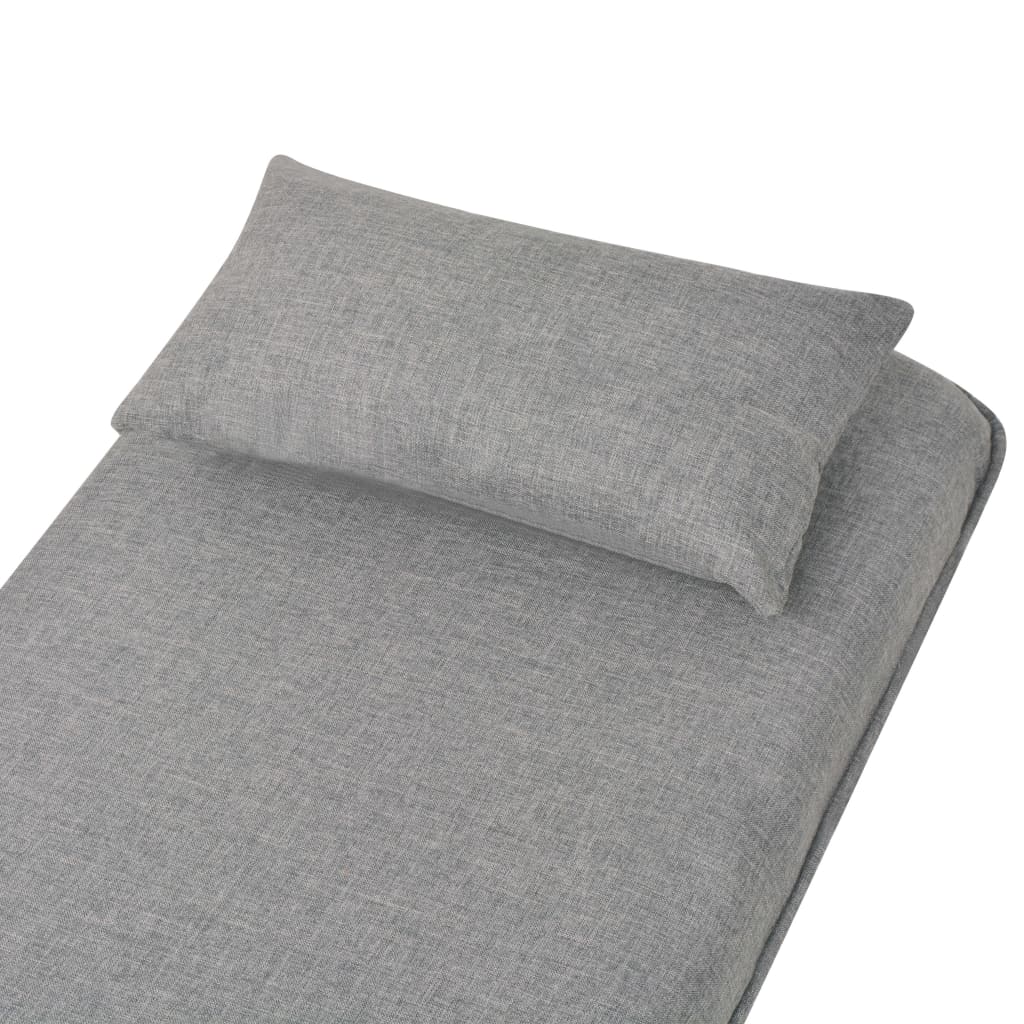 Fauteuil pivotant et canapé-lit en tissu gris clair