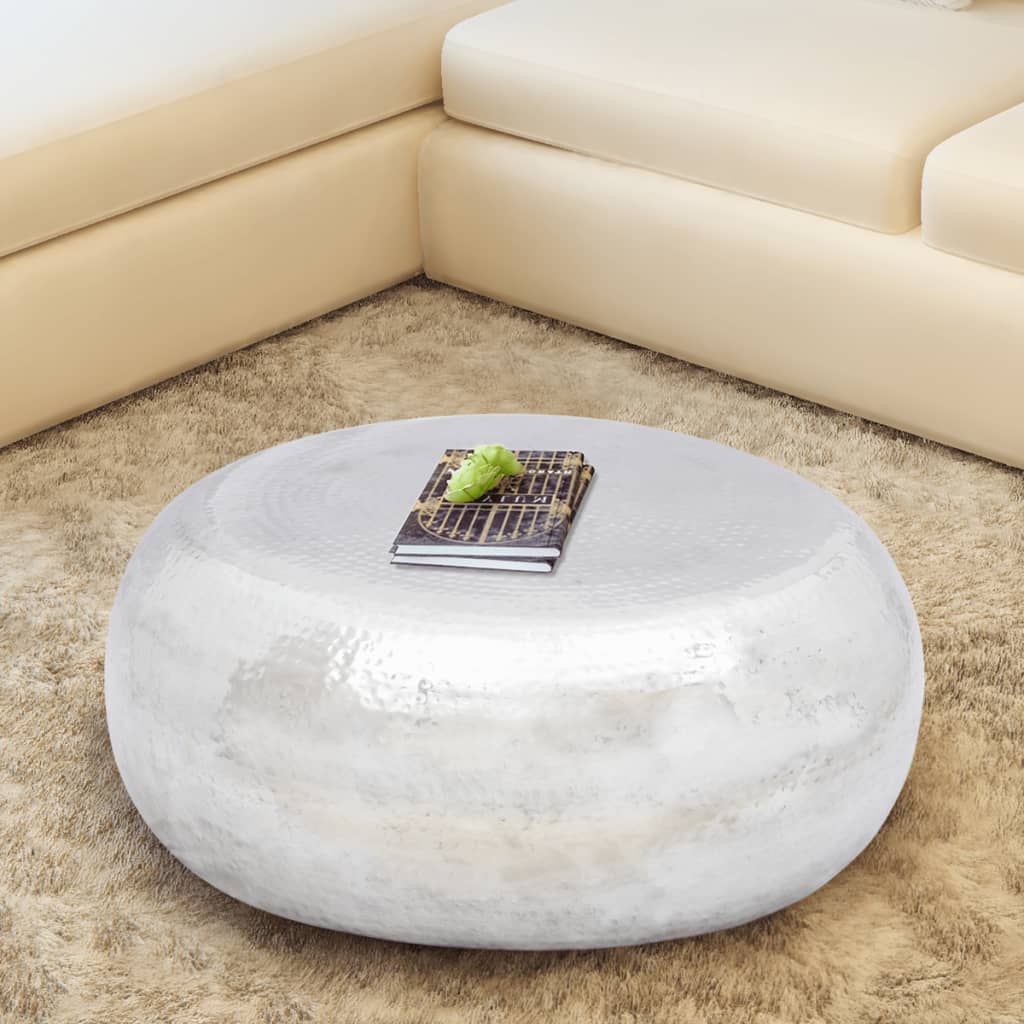 Coffee table made of hammered aluminum silver