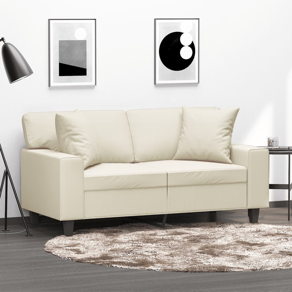 Canapé 2 places avec coussins décoratifs crème 120 cm simili cuir