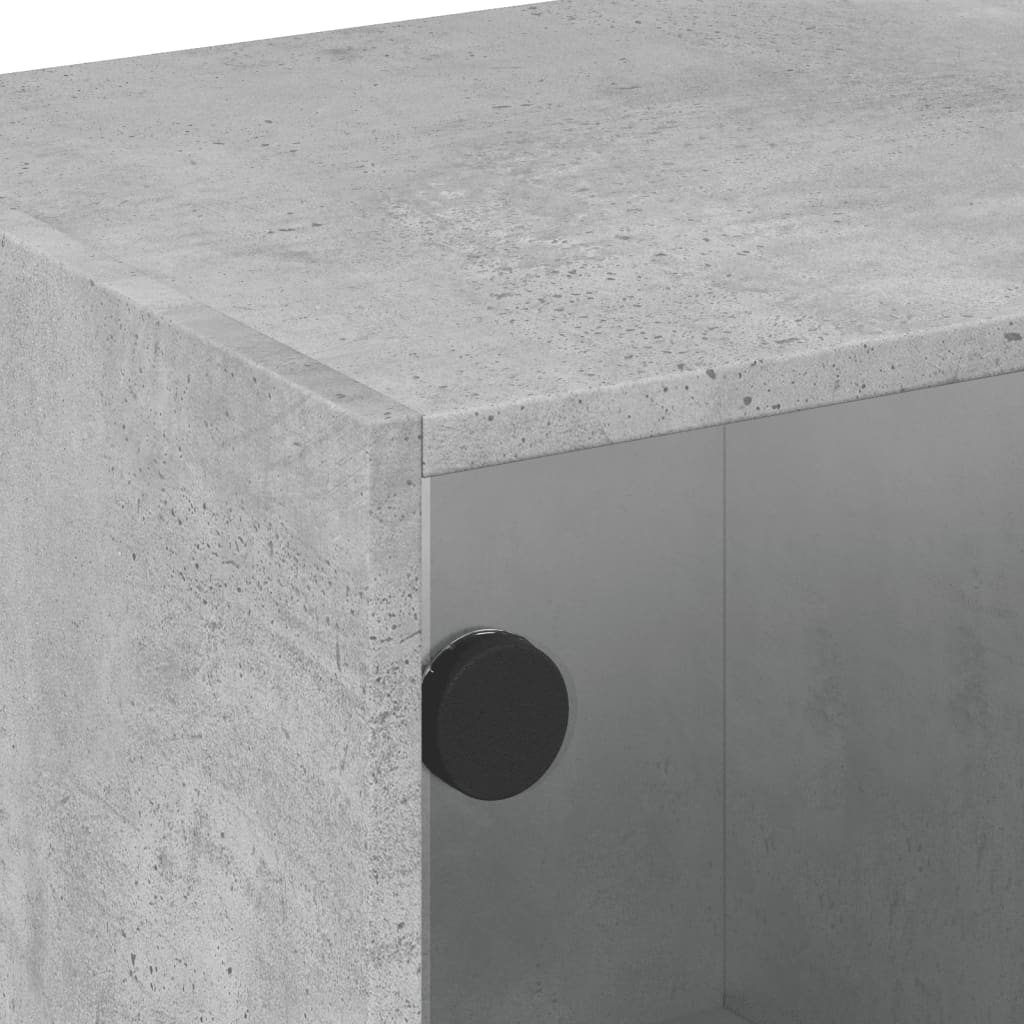 Table basse avec portes vitrées gris béton 68x50x42 cm