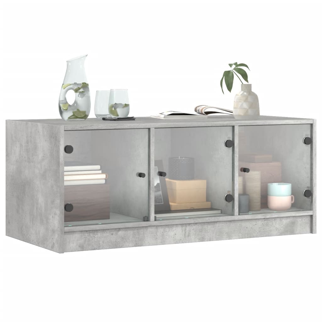 Table basse avec portes vitrées gris béton 102x50x42 cm