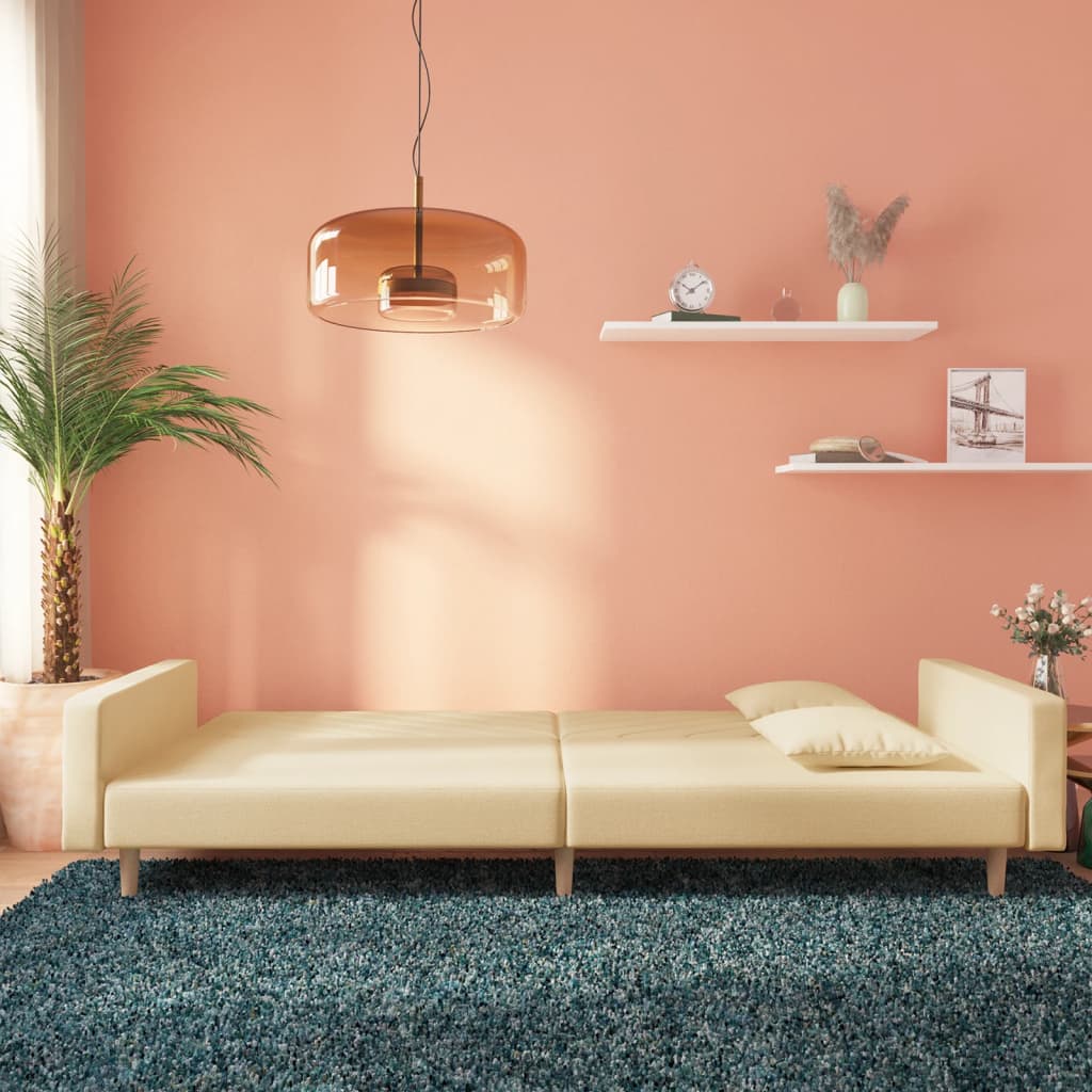Canapé convertible 2 places avec 2 coussins en tissu crème