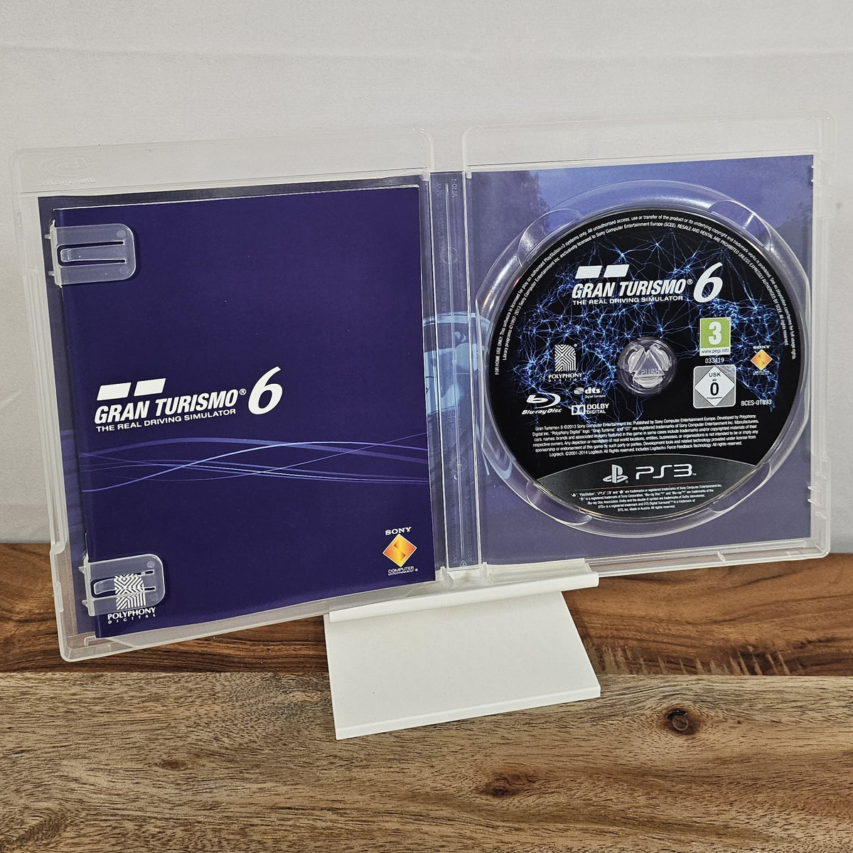 Gran Turismo 6 für PlayStation 3 – geöffnete Originalhülle mit Spiel-Disc
