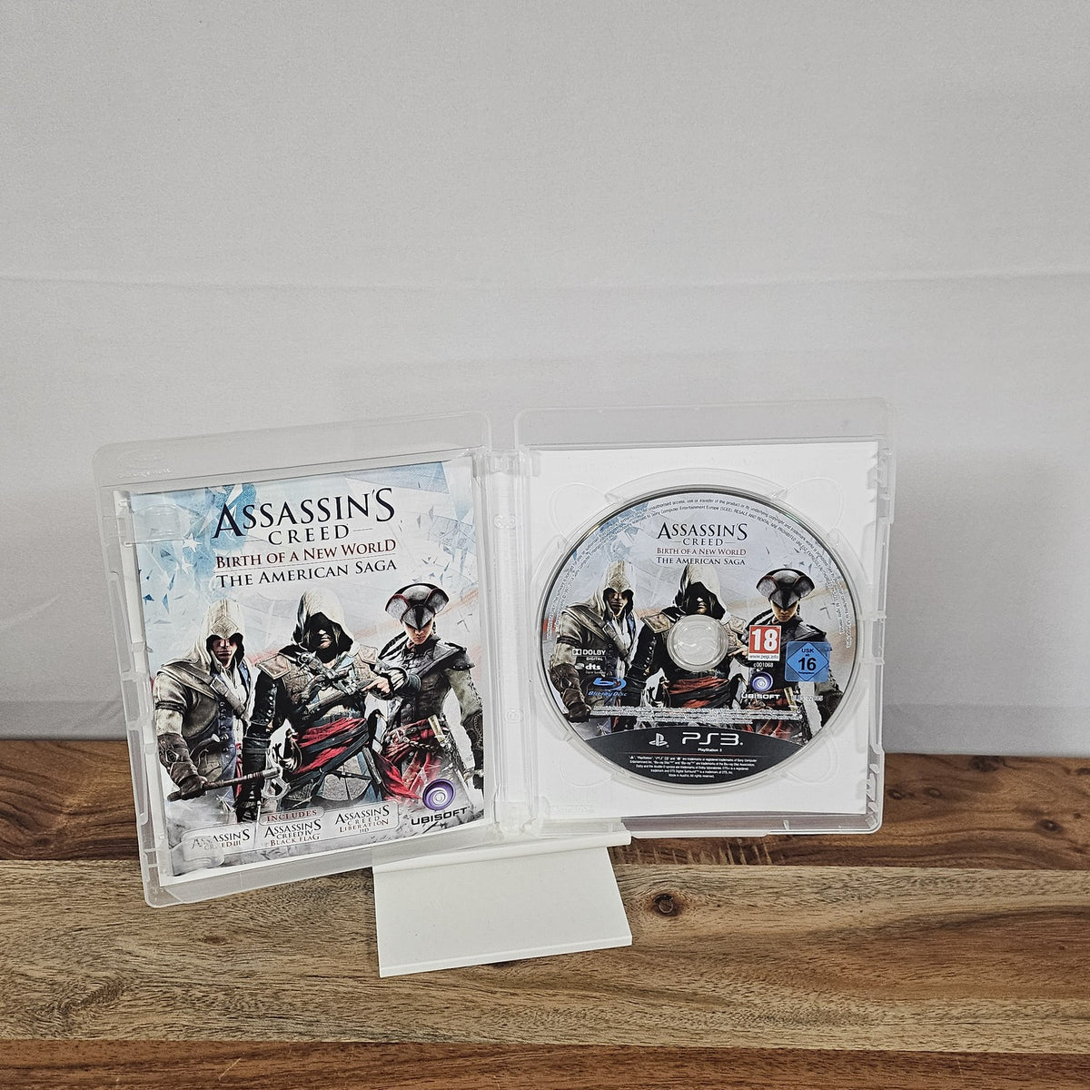 Assassin’s Creed The American Saga für PlayStation 3 – geöffnete Originalhülle mit Spiel-Disc und Einleger