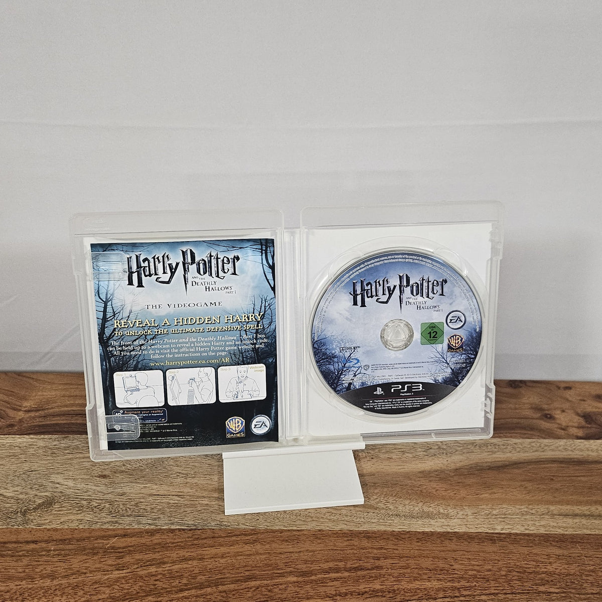 Harry Potter and the Deathly Hallows Part 1 für PlayStation 3 – geöffnete Originalhülle mit Spiel-Disc und Einleger