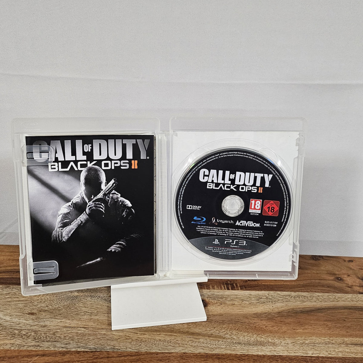 Call of Duty: Black Ops II für PlayStation 3 – geöffnete Originalhülle mit Spiel-Disc und Unterlagen