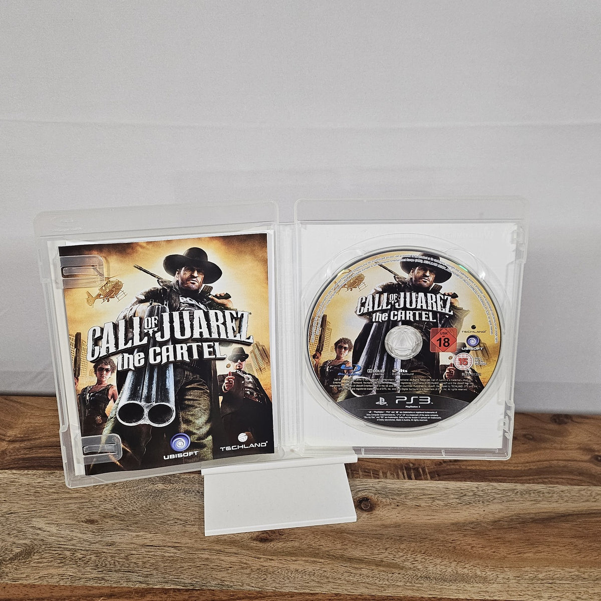 Call of Juarez: The Cartel für PlayStation 3 – geöffnete Originalhülle mit Spiel-Disc und Unterlagen