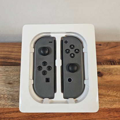 Graues Nintendo Switch kompatibles Controller Set im Verpackungseinsatz