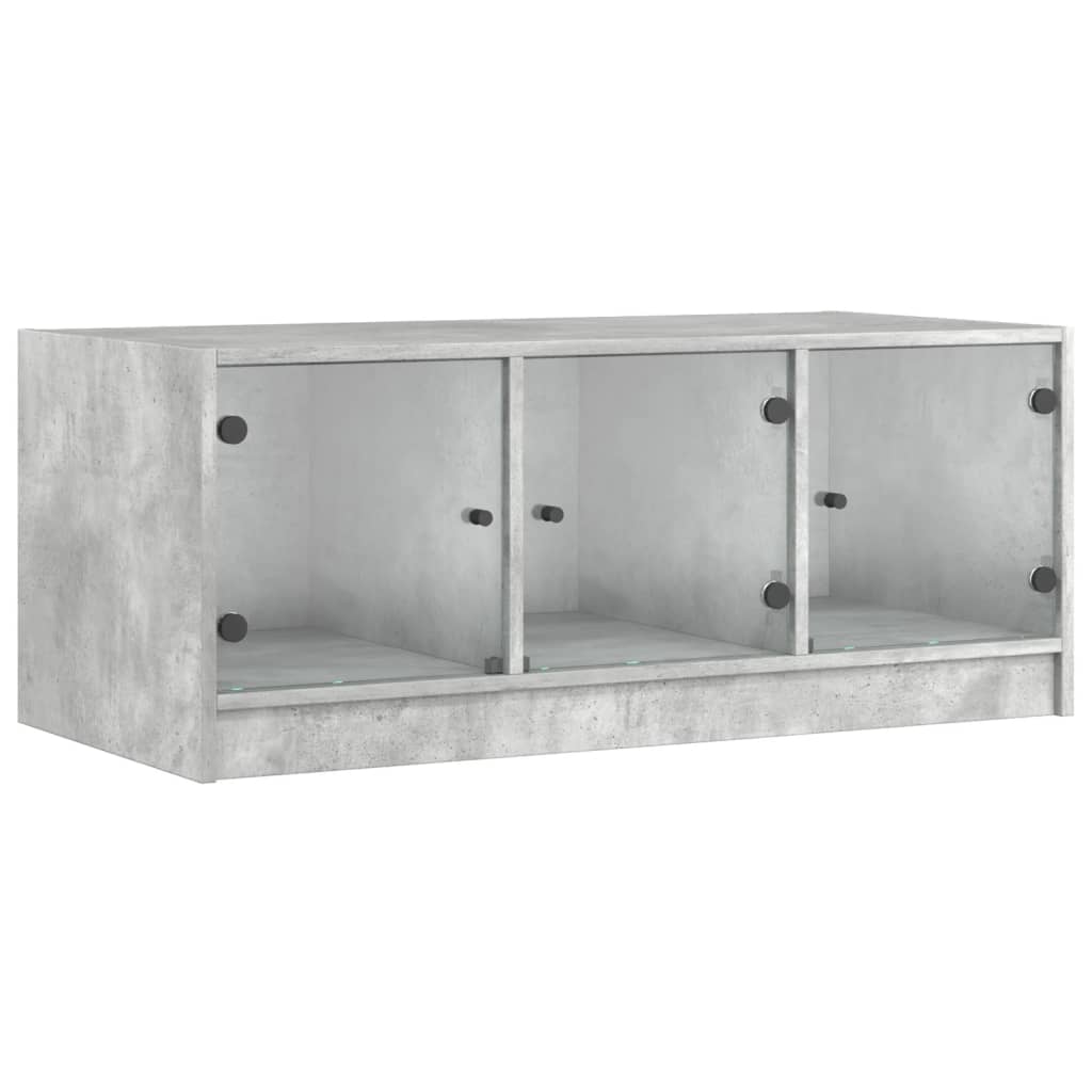 Table basse avec portes vitrées gris béton 102x50x42 cm
