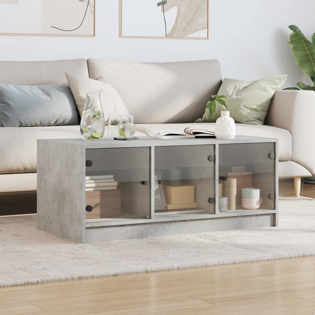 Table basse avec portes vitrées gris béton 102x50x42 cm