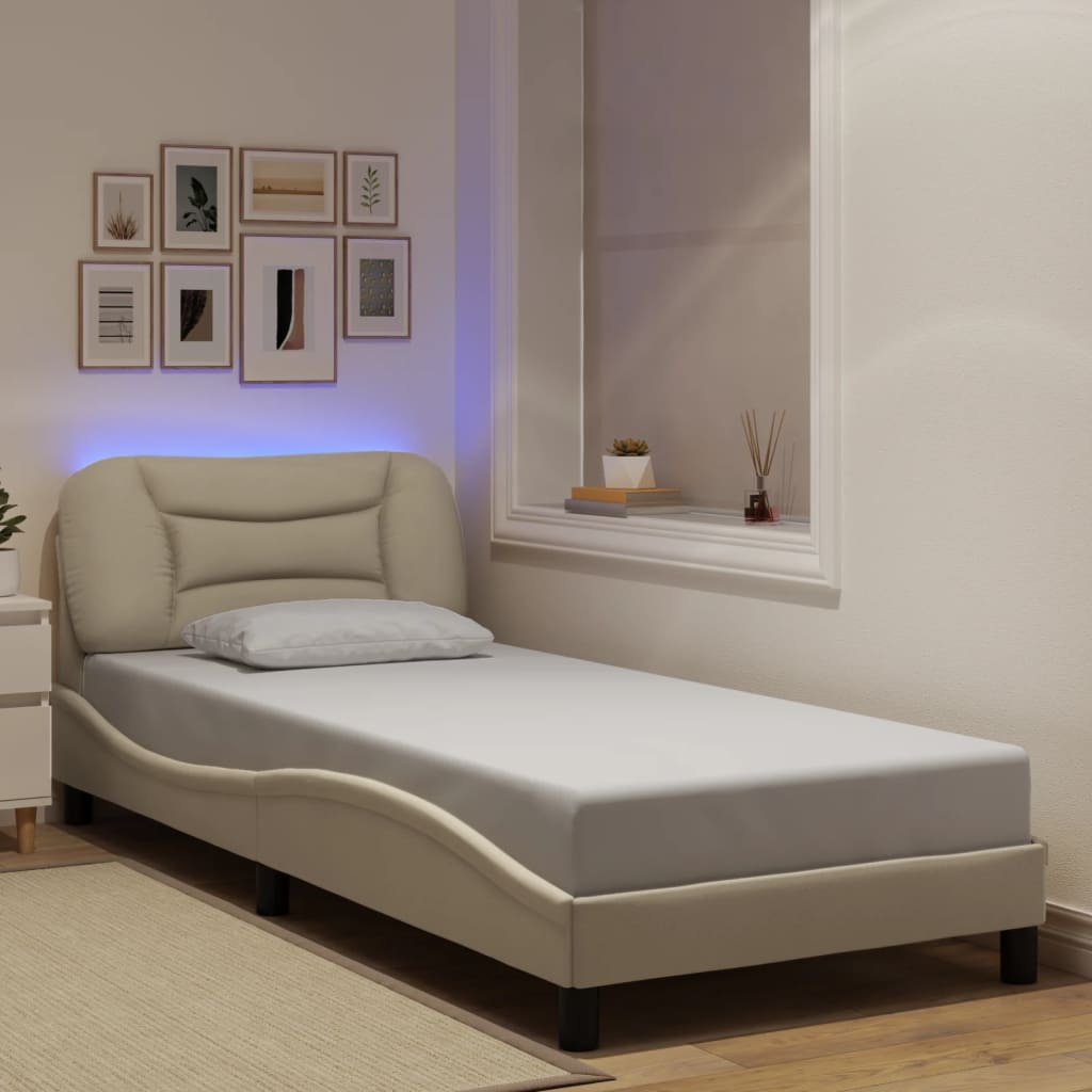 Bed frame with LED without mattress cream 90x190 cm fabric