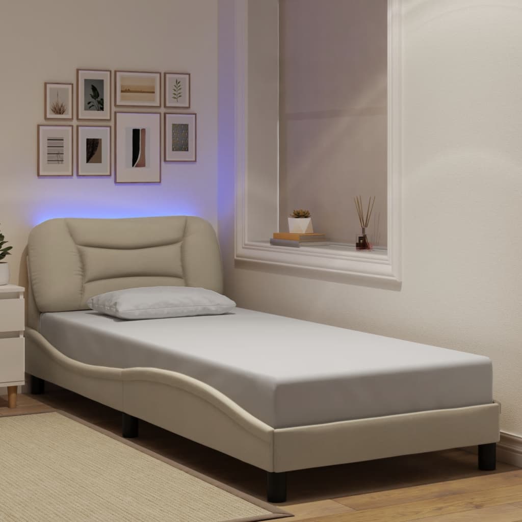 Bed frame with LED without mattress cream 90x200 cm fabric