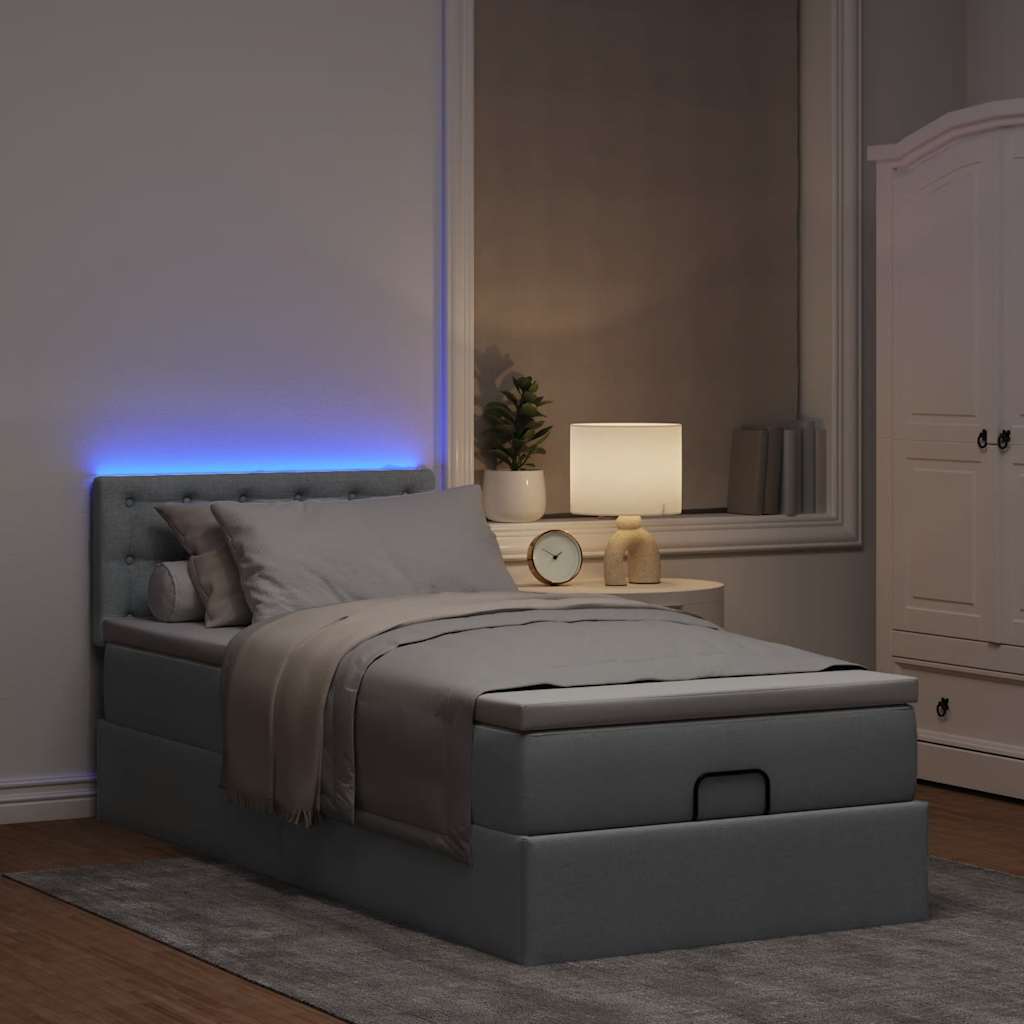 Lit ottoman avec matelas et LED gris clair 100x200 cm tissu