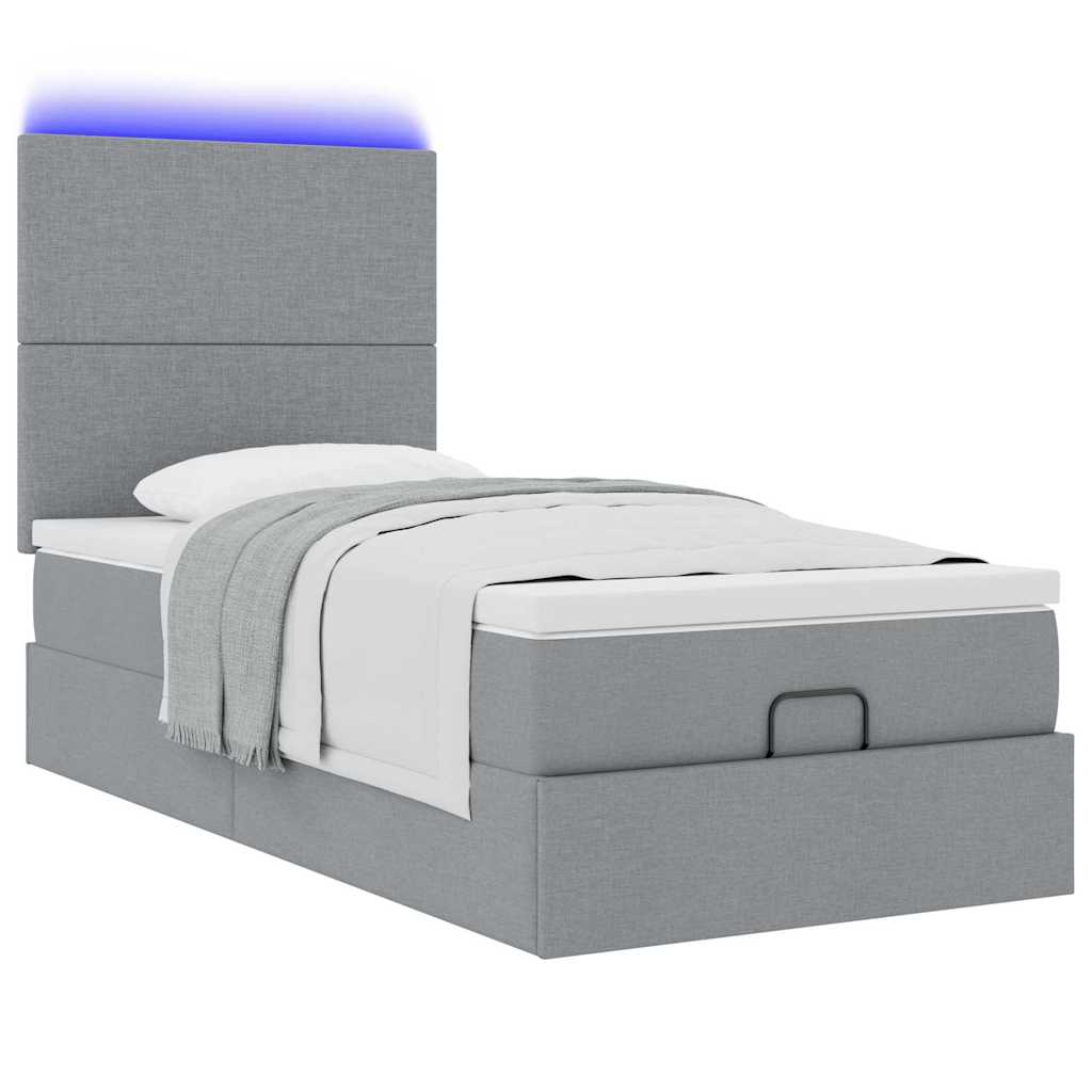 Lit ottoman avec matelas et LED gris clair 100x200 cm tissu