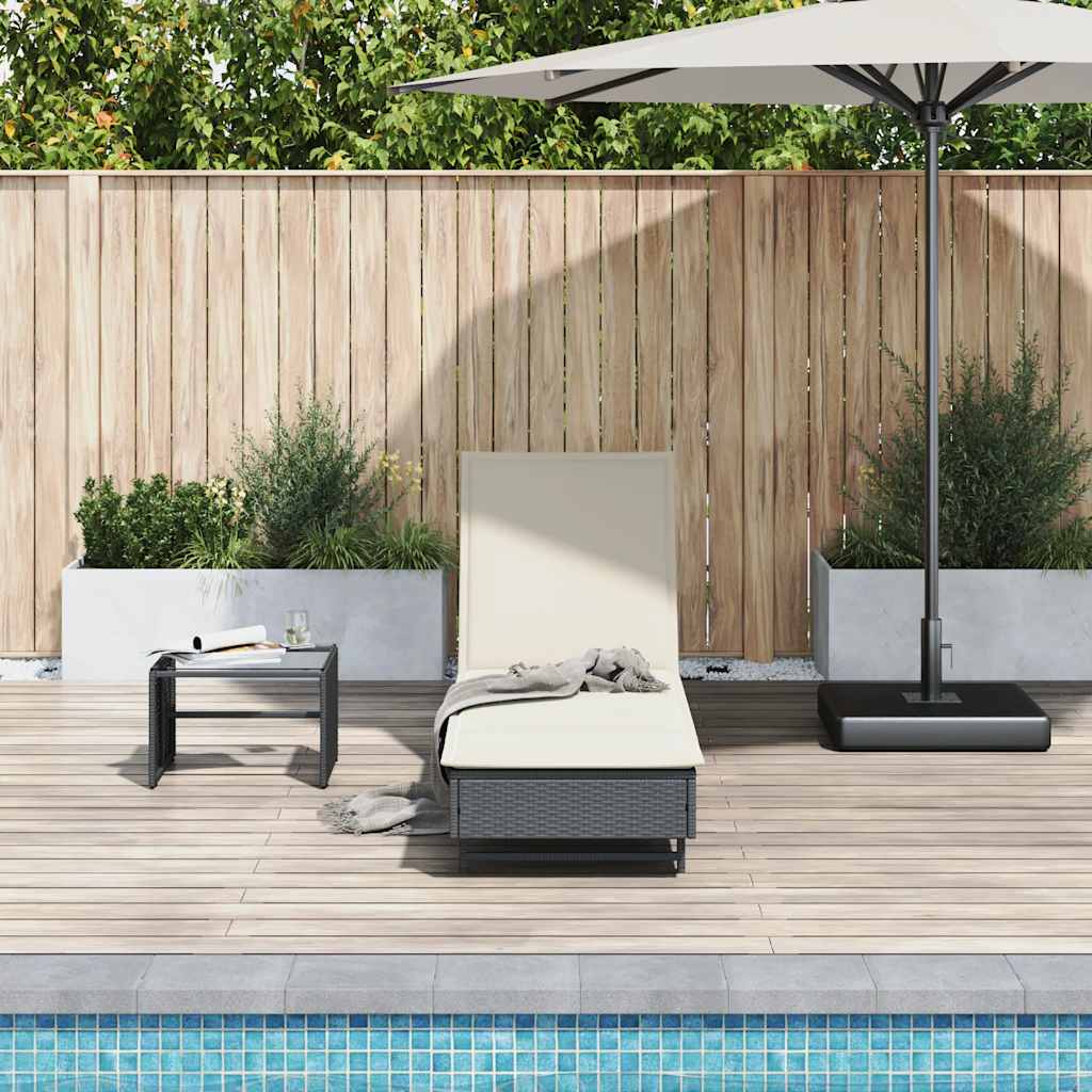 Bain de soleil à roulettes et coussin en polyrotin noir