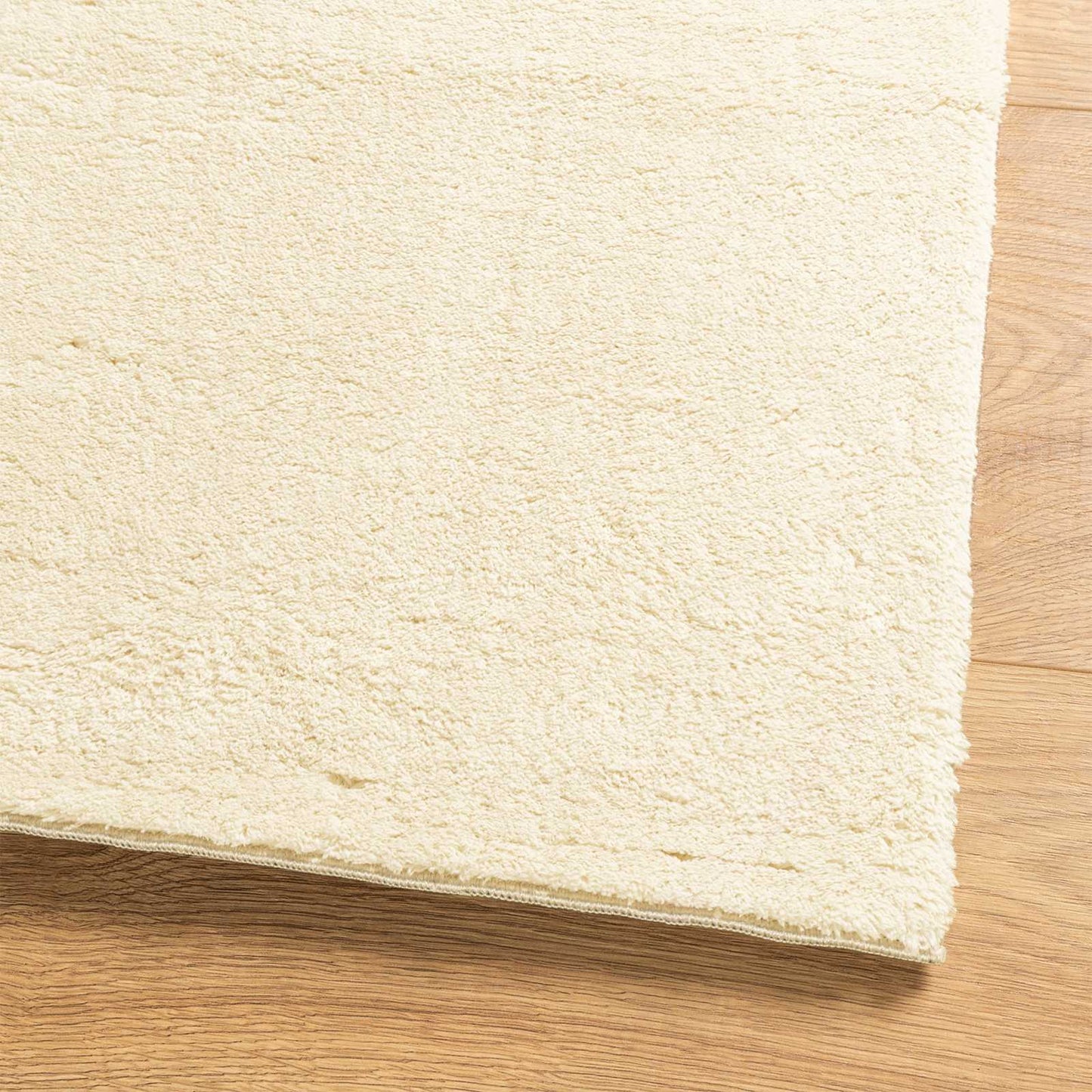 Mittlerer Flor weicher und waschbarer Teppich HUARTE Creme