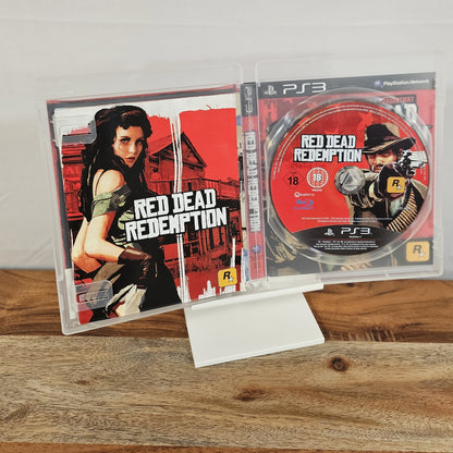 Red Dead Redemption für PlayStation 3 – geöffnete Originalhülle mit Spiel-Disc und Unterlagen