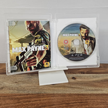 Max Payne 3 für PlayStation 3 – geöffnete Originalhülle mit Spiel-Disc und Einleger